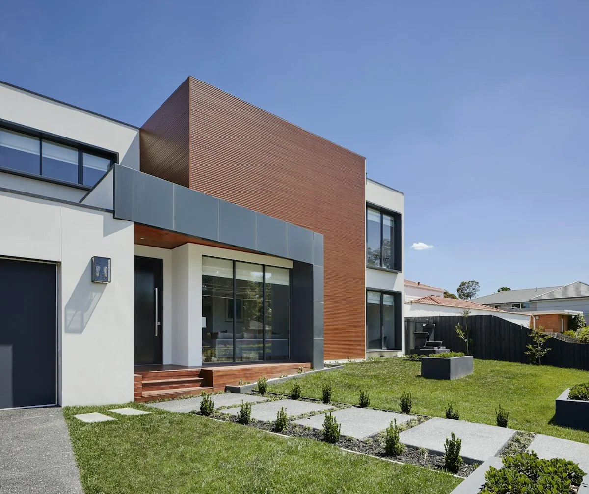 Modern custom residence with a manicured lawn