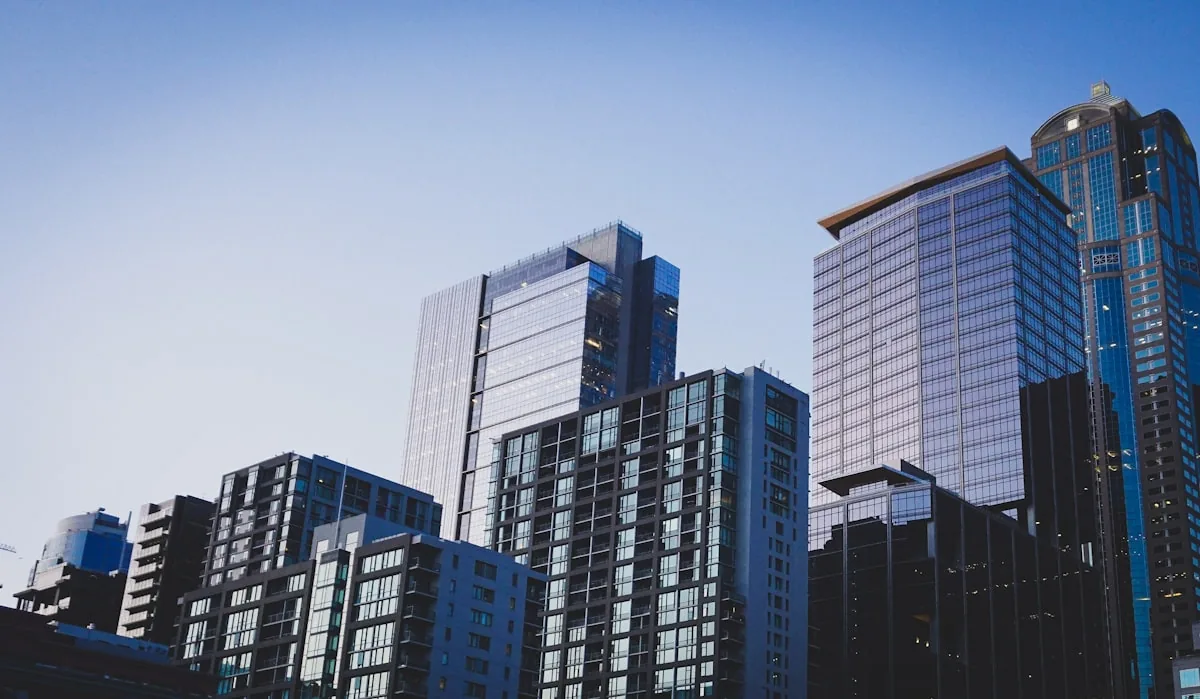 Multifamily and mixed-use towers against a clear blue sky